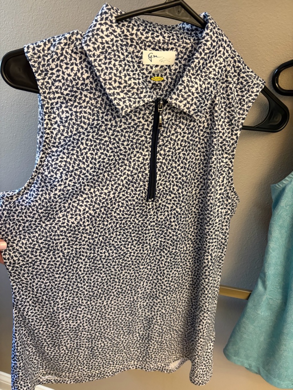 Greg Norman Collection Women’s Sleeveless Golf Polo — Navy/White Leaf Print